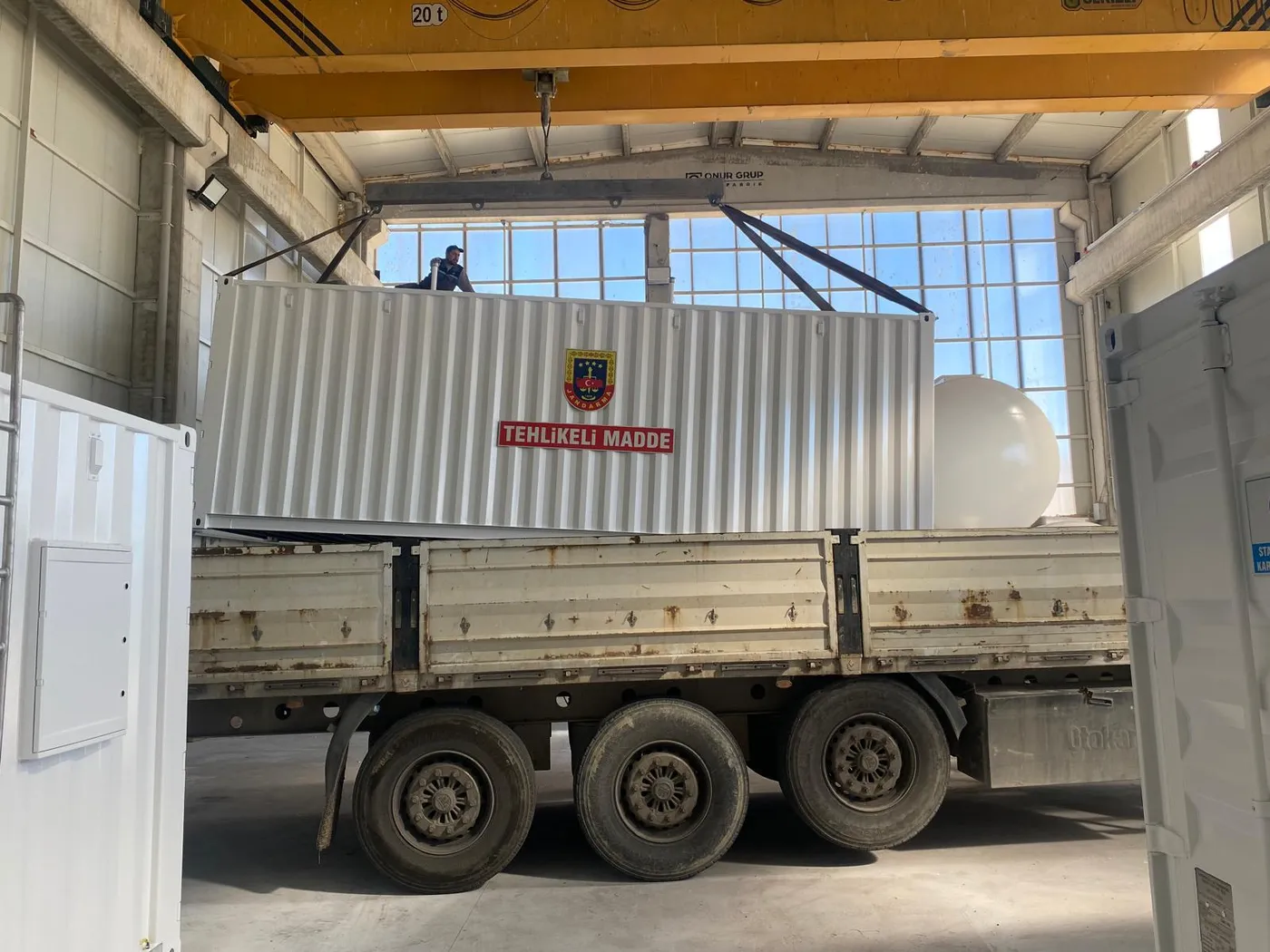 Crane loading a mobile station container